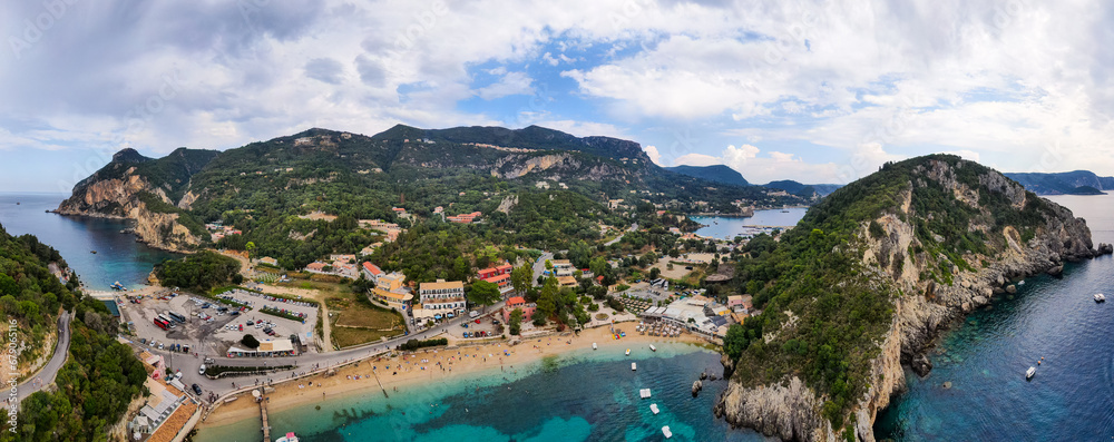 Picturesque seaside of Paleokastritsa, Corfu, Greece. Beautiful bay in Paleokastritsa in Corfu island, Greece. Panoramic view of Palaiokastritsa, boats and beach Corfu, Greece