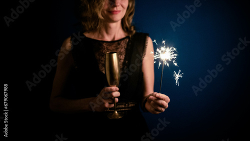 woman holding sparkles Happy New Year