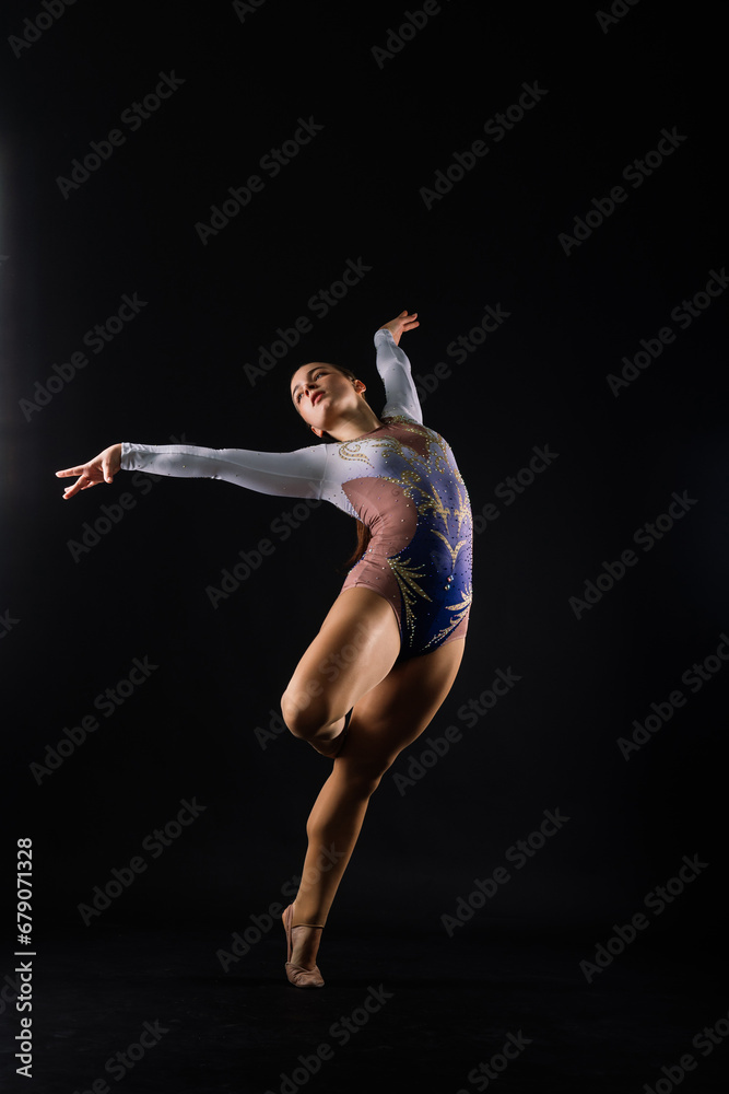 Ballet dancer in black body paint isolated on studio background expressive artistic dance concept
