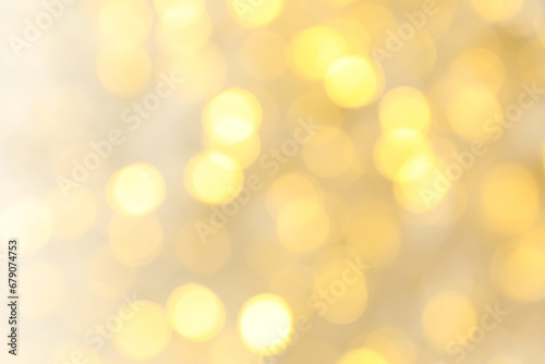Blurred yellow lights on white background, space for text © Atlas