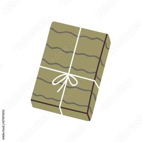 Holiday gift box in festive wrapping with string bow. Birthday present packag...