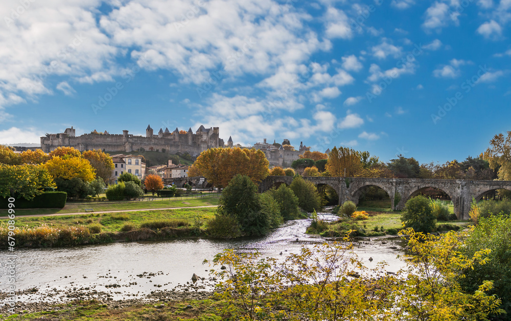 The city of Carcassonne and the old bridge, from the new bridge and the Aude river, in Aude, in Occitanie, France.
