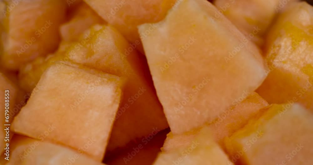 sliced orange melon close-up, delicious soft and ripe food melon on the table sliced orange melon close-up, delicious soft and ripe food melon on the table
