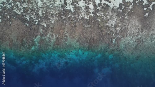 Beautiful tropical blue ocean reef aerial view top down video photo