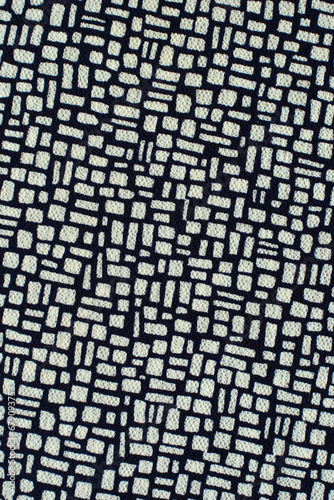 black and white fabric with an abstract pattern for clothes  top view. textile material with white ornament. clothing industry