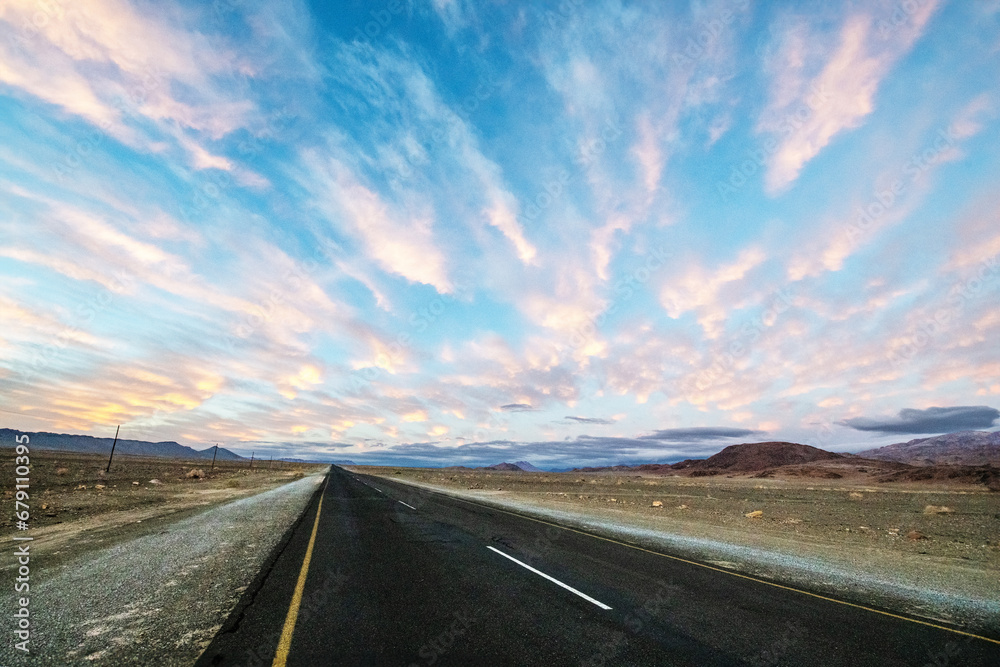 Long road into the empty desert landscape