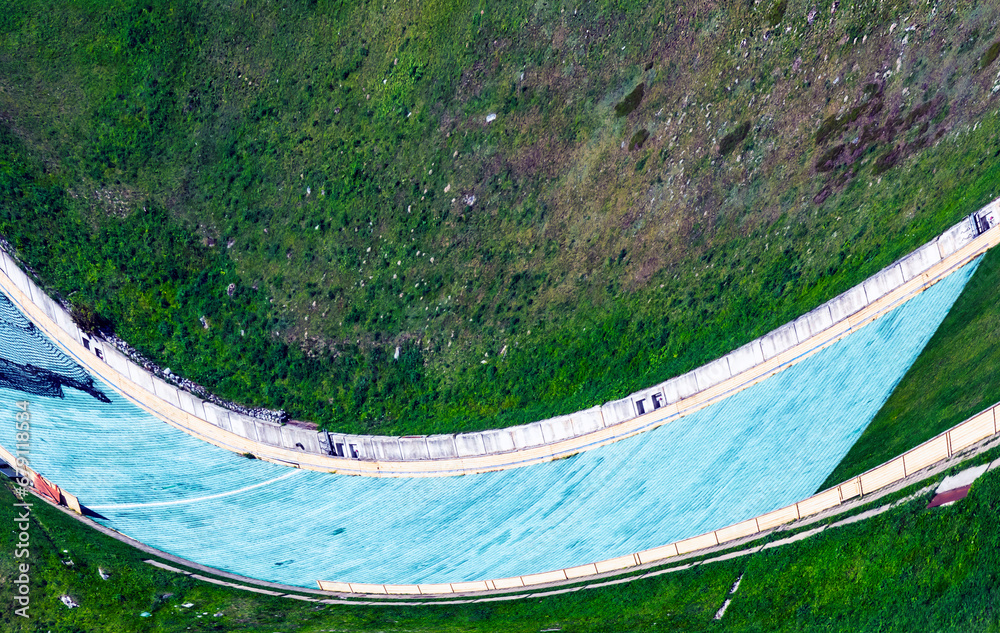 Ski jumping bridge in the summer in the mountains