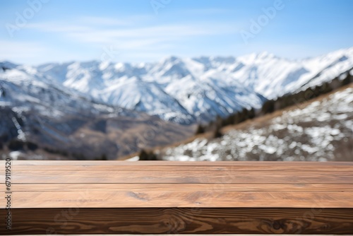close up of a wooden table with the mountains covered with snow in winters © DailyLifeImages