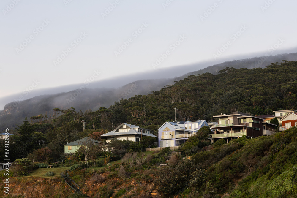 Houses on the hill with foggy sky. Houses on the hill with foggy sky.