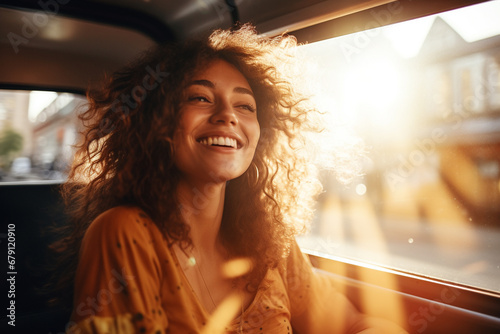 Closeup portrait of a cheerful young woman with windy hair sitting at a car. Generative AI. photo