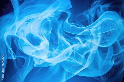 captured smoke forming shapes against a blue background