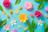 Colorful flowers on blue background. Flat lay, top view.IA generativa