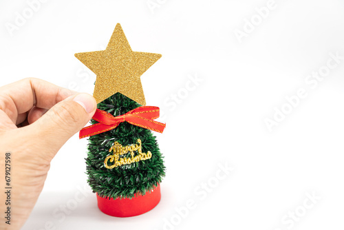 Little Christmas tree and Gold Star isolated on white background. Christmas background.