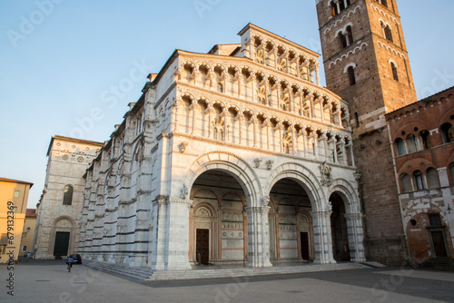Facade of Lucca Cathedral. It is a Roman Catholic cathedral dedicated to Saint Martin of Tours in Lucca, Tuscany, Italy. It is the seat of the Archbishop of Lucca. photo
