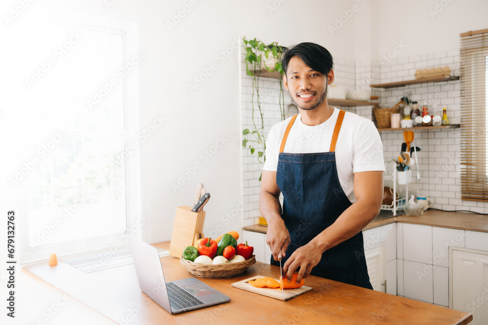 Man hands preparing a healthy salad. Cutting vegetables tomatoes on a cutting board Man hands preparing a healthy salad. Cutting vegetables tomatoes on a cutting board