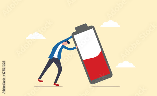 Fight burnout at work. Intolerance to burnout syndrome. Employees tried to prevent a large battery from falling over it. Recharge energy yourself. 