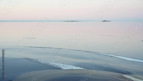 Ice on the Bothnian Bay on a cold winter morning just before sunrise with pastel colors, Kuivaniemi, Ii, Finland photo