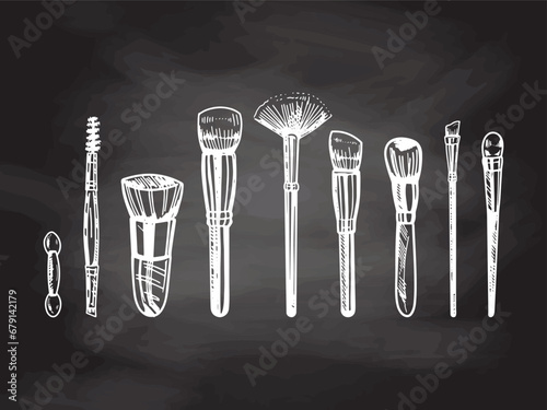 A set of hand-drawn doodle sketches of makeup brushes on chalkboard background.  Illustration for beauty salon, cosmetic store, makeup design. Engraved image.