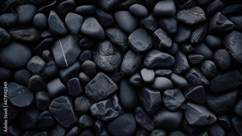 Pebbles background. Black pebble stones background texture.