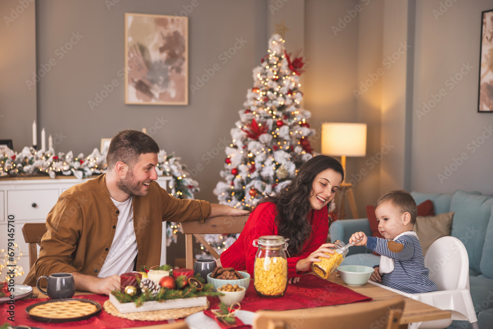 Toddler having cereals for Christmas morning breakfast at home