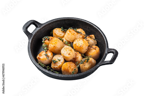 Scallops seared in garlic, thyme and butter served in cast iron skillet.  Transparent background. Isolated.