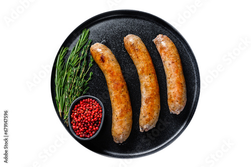 Sausages fried with spices and herbs on a plate. Transparent background. Isolated.