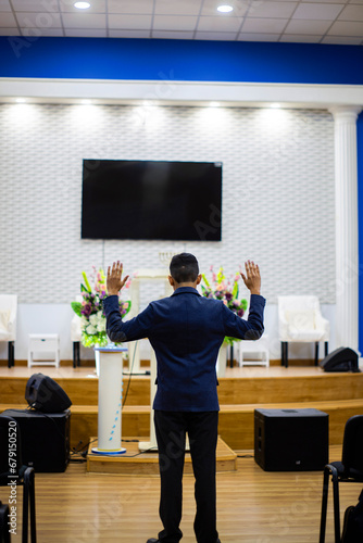 man hands up liberation church
