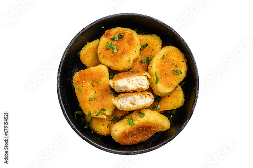Crispy fried chicken nuggets in a pan with ketchup and herbs.  Transparent background. Isolated.
