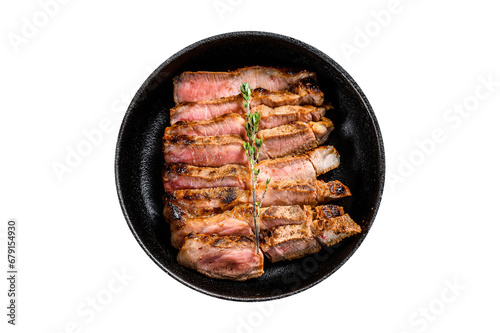 Sliced pork chop steak on a bone with spices and herbs. Transparent background. Isolated.