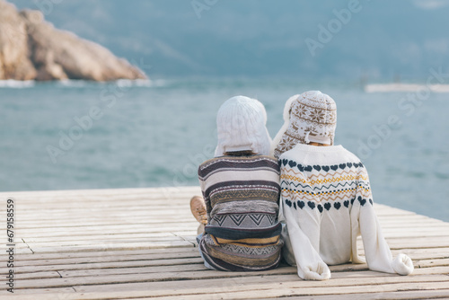 Children travelling in warm wool sweaters and winter hats.