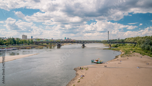 Summer city beach on the Vistula River in Warsaw overlooking the city