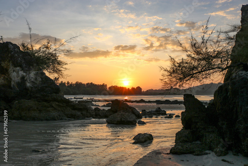 Magnificent colorful sunset in a rocky sea bay.