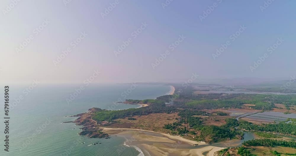 Aerial top view of the calm ocean and the coastline with agricultural fields Aerial top view of the calm ocean and the coastline with agricultural fields