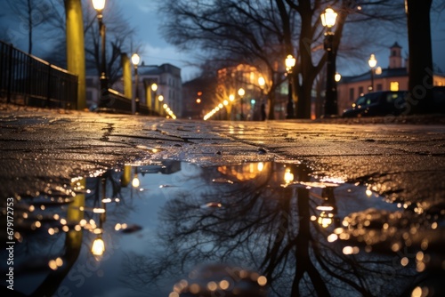 A captivating winter scene of shimmering Christmas lights mirrored in a city street puddle