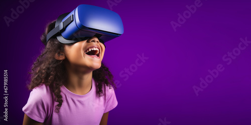 Young girl getting experience using VR headset glasses isolated on a blue background with copy space