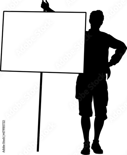 Protestor or demonstrator at a demonstration march, picket line or strike protest rally in silhouette. Holding up a banner or picket sign board placard.