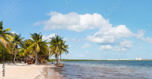 Fototapeta Naklejka Na Ścianę i Meble -  Paradise Sunny beach with palms and turquoise sea. Summer vacation and tropical beach concept - Cancun, Mexico