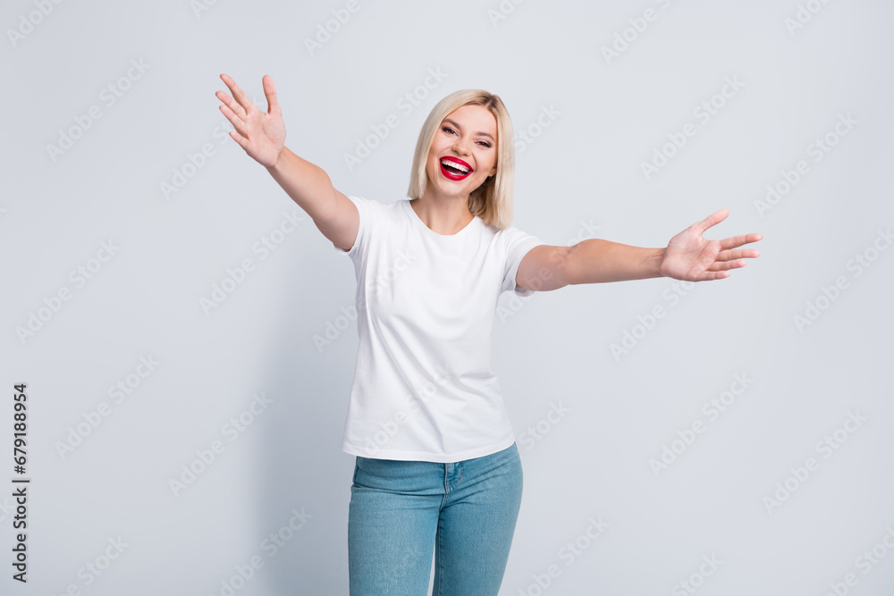Photo of cheerful adorable glad girl wear stylish clothes open hands hugging you isolated on grey color background