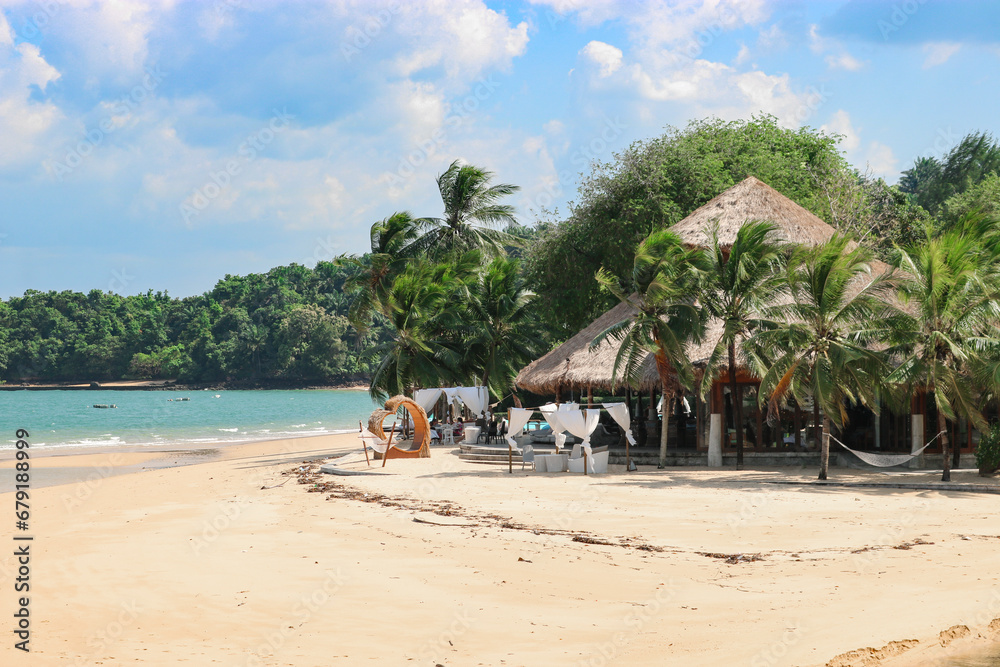 Resort on a tropical island, white beach, turquoise sea.