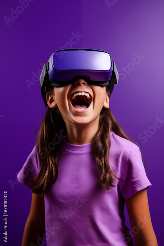 Young girl getting experience using VR headset glasses isolated on a blue background © dewaai