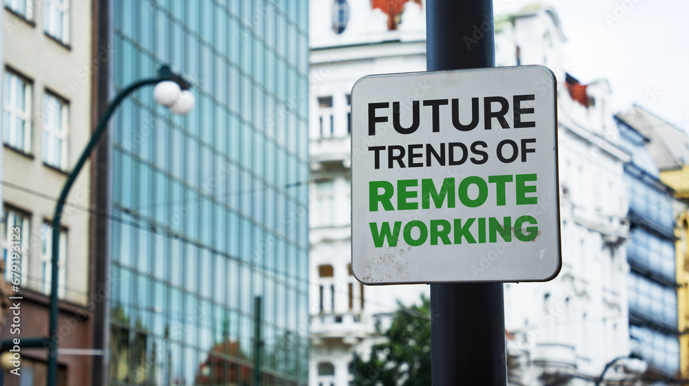Obraz premium Future trends of remote working written on a sign in front of office buildings