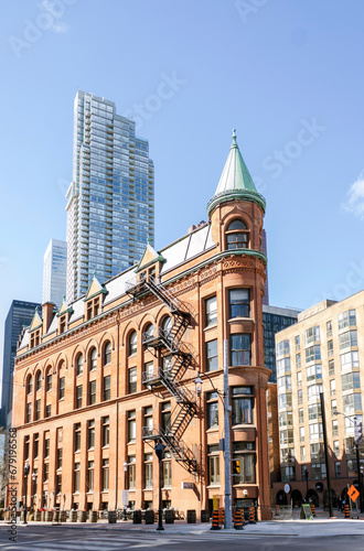 New and old architecture at Toronto Downtown. Gooderham Building, known Flatiron Building