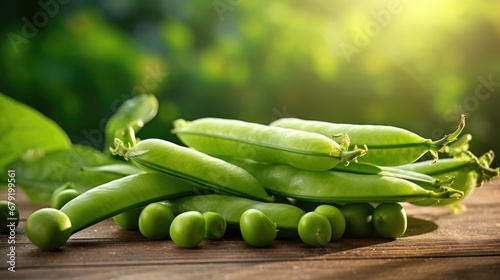Pods of green peas with leaves on wooden table. Fresh food background