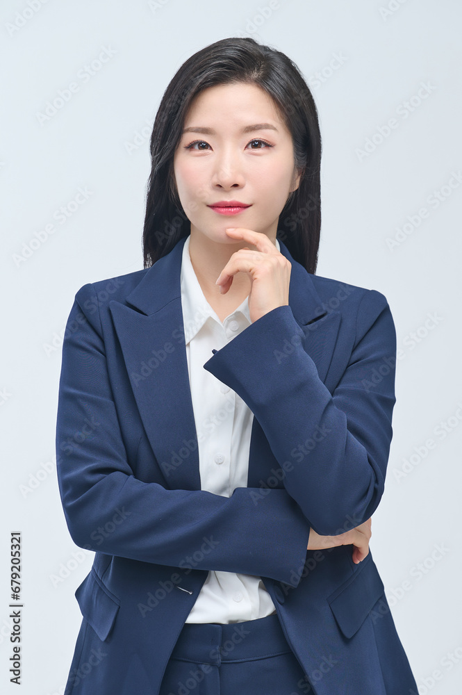 A young businesswoman in a suit is making various facial expressions and gestures. A young businesswoman in a suit is making various facial expressions and gestures.