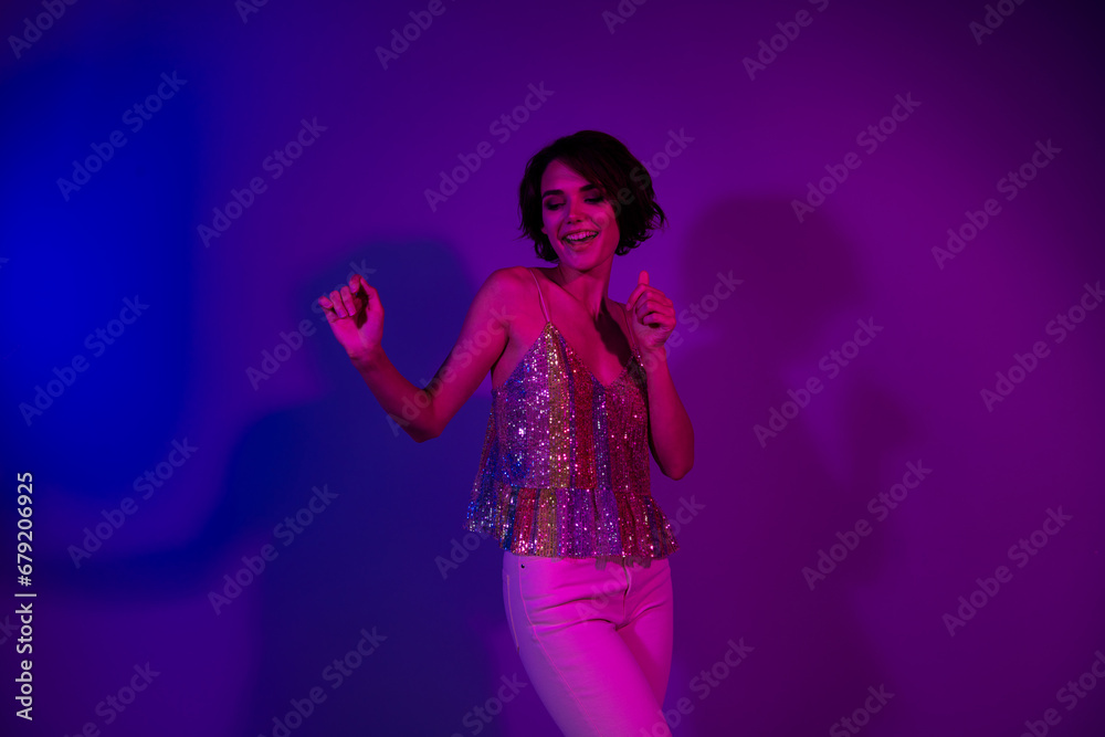 Photo of cheerful energetic lady bachelorette dance on prom party valentine day isolated neon ultraviolet color background