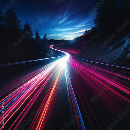 fotografia con detalle de carretera de montaña al atarceder con lineas de luz veloces de diferentes colores