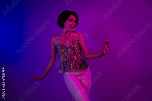 Photo of cheerful lady girl dance active on new year christmas party event isolated neon colorful background