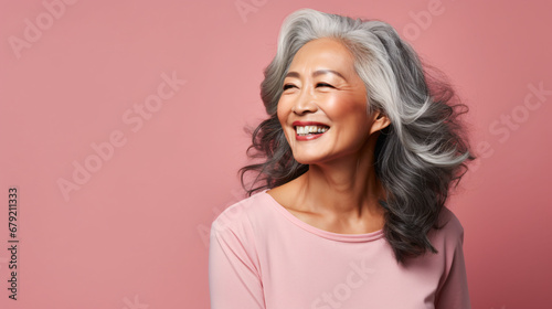 Contemporary Senior Style: Asian Model with Grey Hair on Solid Studio Background