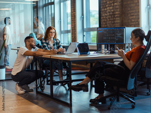 A diverse group of young business individuals congregates in a modern startup coworking center, embodying collaborative innovation and a dynamic atmosphere