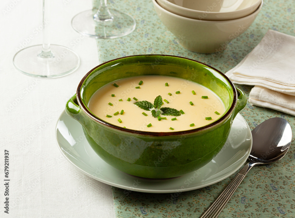Cream of white asparagus in a green bowl. The rustic style. Selective focus